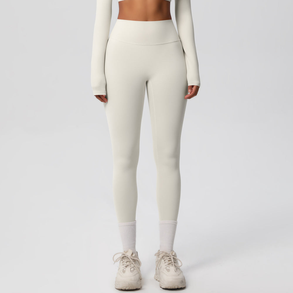 High-waisted, brushed nylon yoga pants with a cloud-like feel, designed for outdoor sports. these compression leggings are quick-drying and perfect for running and fitness. custom manufacturing available