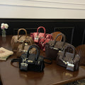 High-end women's bag, 2025 new arrival, vintage-inspired, niche design, lock closure bag, trendy and versatile for autumn, can be used as a shoulder bag, crossbody bag, or handbag