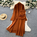 Minimalist solid color knitted mature woman's winter set: slim-fit bandeau dress with long cardigan coat