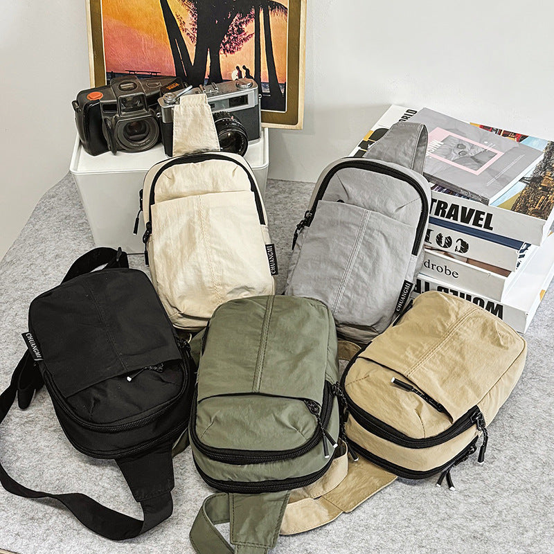 Small breast bag men's simple mini small satchel men's summer casual mobile phone bag carry-on bag men's messenger bag women