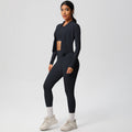 High-waisted, form-fitting yoga pants, a barely-there feel, quick-drying outer layer, and a long-sleeved tee – a women's three-piece activewear set perfect for running and workouts