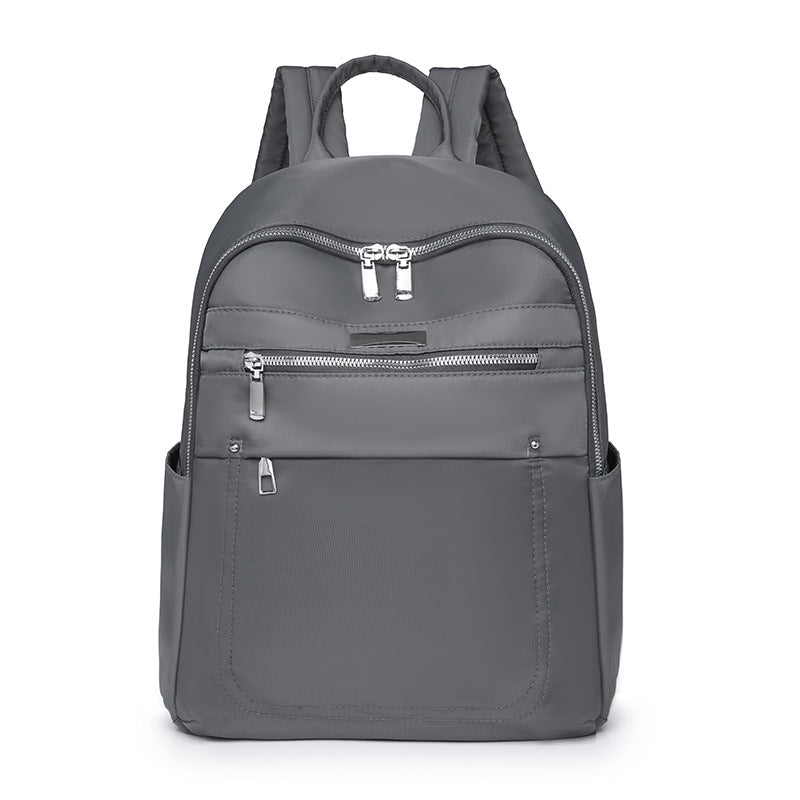 Solid color fashion casual versatile backpack simple trend lightweight business women's computer bag wholesale student schoolbag