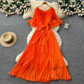 French-inspired pleated dress for women, featuring a bow tie, off-the-shoulder design, tie-waist, and flattering pleats for an elegant and sophisticated look