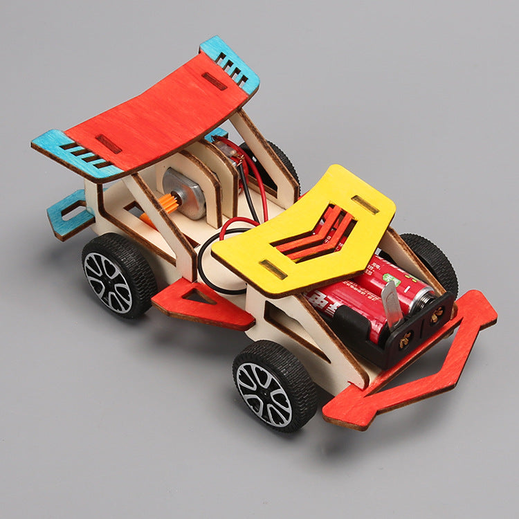Science and technology small production creative electric wooden racing students invent and assemble scientific experimental toys handmade materials