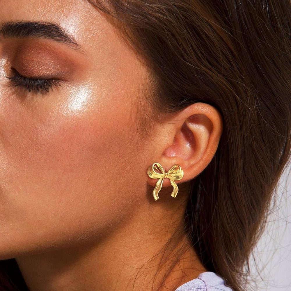 Amazon cross-border fashion light luxury gold-plated copper stud earrings, gold bow earrings, high-end women's jewelry wholesale