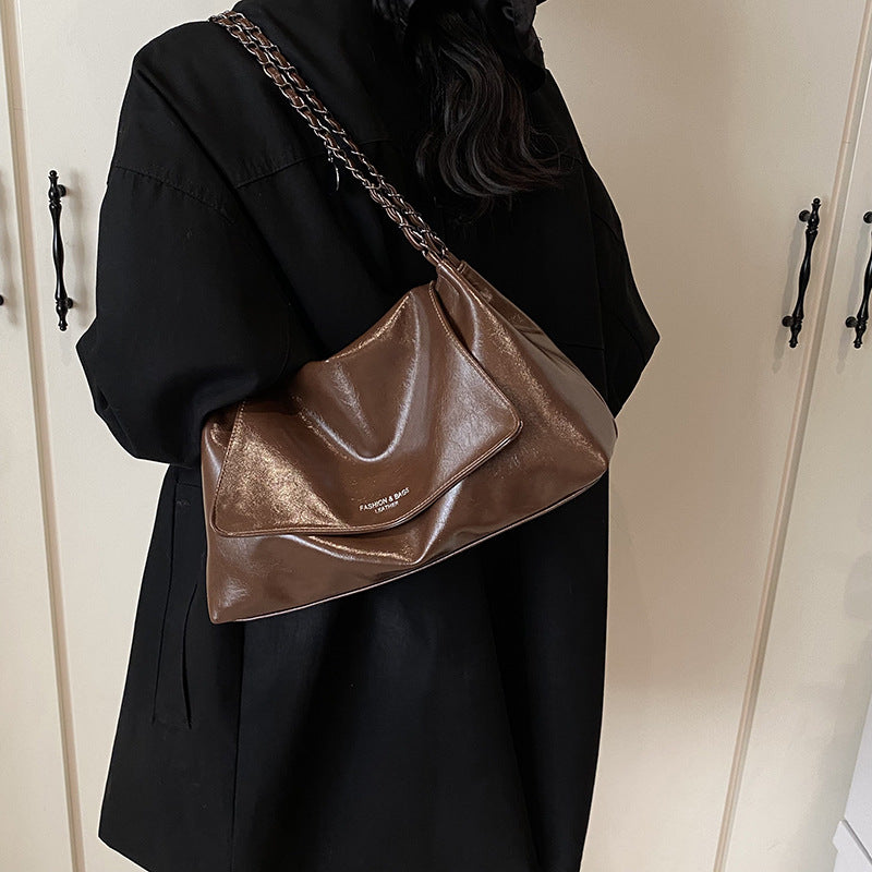Solid color simple large-capacity foreign gas bag women's 2025 new trendy underarm commuter chain single shoulder tote bag