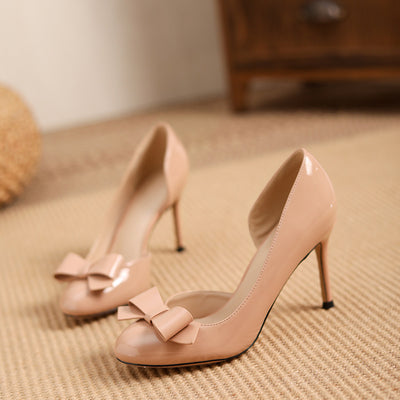 2025 new nude thong heel pumps: elegant, comfortable, and chic. featuring a stiletto heel, round toe, and a stylish patent leather bow detail