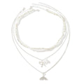 Wholesale diamond-studded mermaid tail bow pendant necklace - european & american cross-border, light luxury, high-end style - women's layering necklace with faux pearl accents
