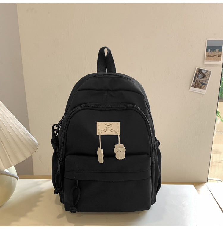 School bag female college student Korean version ins solid color simple and versatile junior high school student travel small backpack high school student backpack