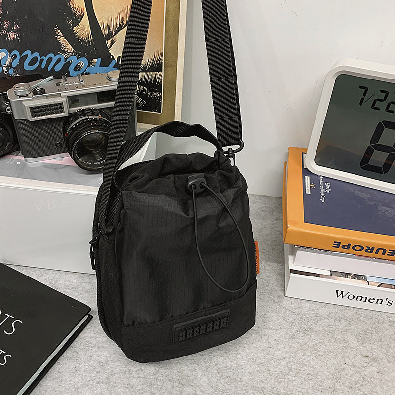 Foreign trade cute contrasting color draw belt small bag women 2025 new versatile sports and leisure shoulder messenger bag cloth bag