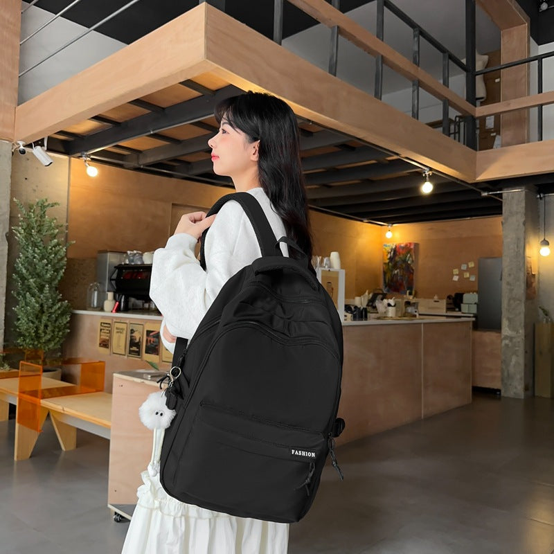 Large capacity burden reduction solid color backpack male junior high school student primary school bag female simple versatile travel backpack