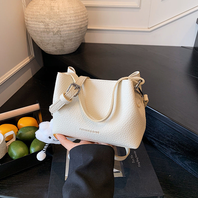 Foreign trade advanced sense bucket bag 2025 summer new niche design light daily commuting hand carry messenger bag