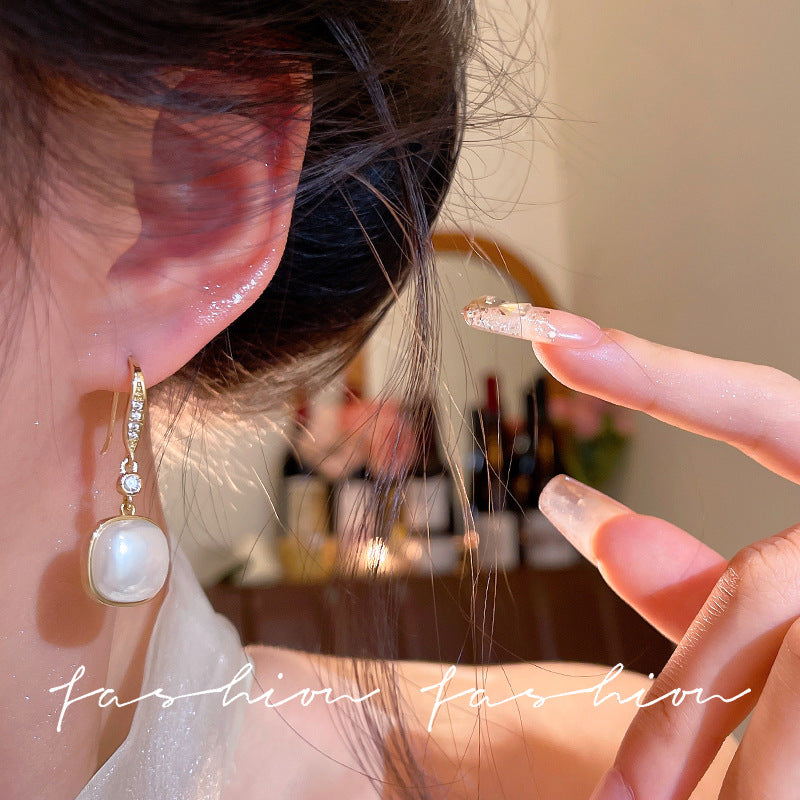 Korean retro pearl pendant earrings women's ins trendy light luxury super sparkling micro-inlaid zircon ear hooks earrings wholesale