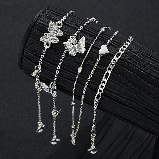 "instagram-worthy, understated luxury anklet set featuring butterfly, shell, and seed beads. available in gold and white gold."