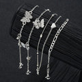 "instagram-worthy, understated luxury anklet set featuring butterfly, shell, and seed beads. available in gold and white gold."