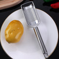 Stainless steel multi-purpose vegetable peeler & slicer - shreds potatoes, onions, radishes, and cucumbers - kitchen gadget