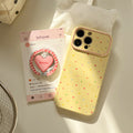 Trendy, custard-yellow iphone 17 case with a full-color heart design and stand. available in contrasting color iphone 18 soft case styles
