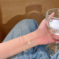 Open double-layer butterfly bangle with high-end pearl chain - women's autumn niche design jewelry, light luxury and unique bracelet