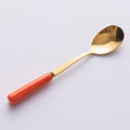 Orange gold spoon