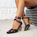 Exquisite black abstract print pointed-toe pumps with chic criss-cross ankle straps and sculptural gold ring heels