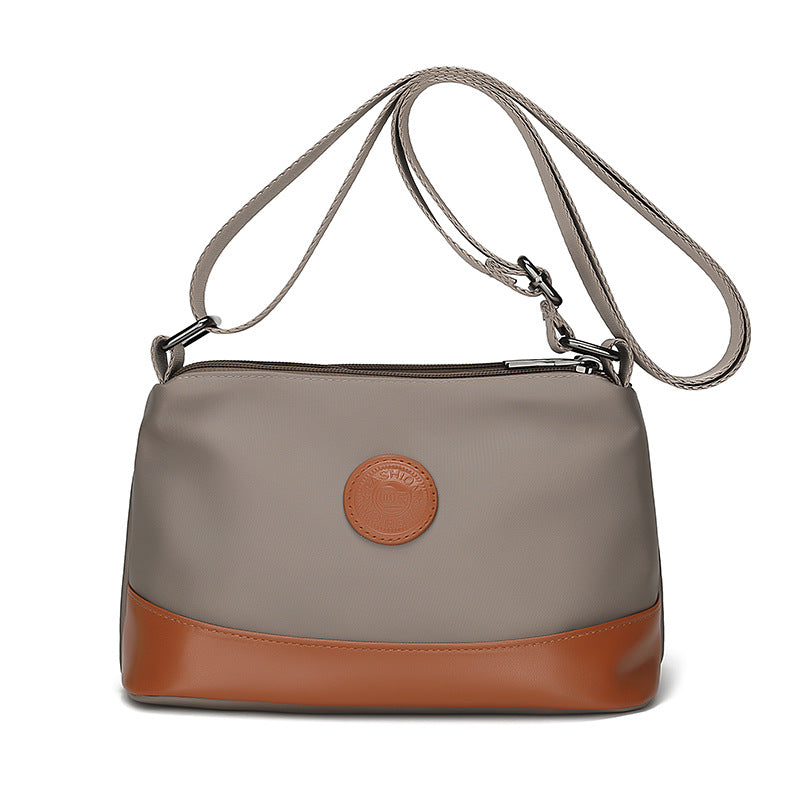 Cross-border color contrast trend women's bags, new casual and light commuting Oxford cloth shoulder bag, three-layer large-capacity messenger bag