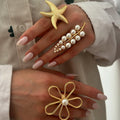 Pearl ring set wholesale european and american cross-border starfish jewelry women's niche high-end hand jewelry hollow open ring