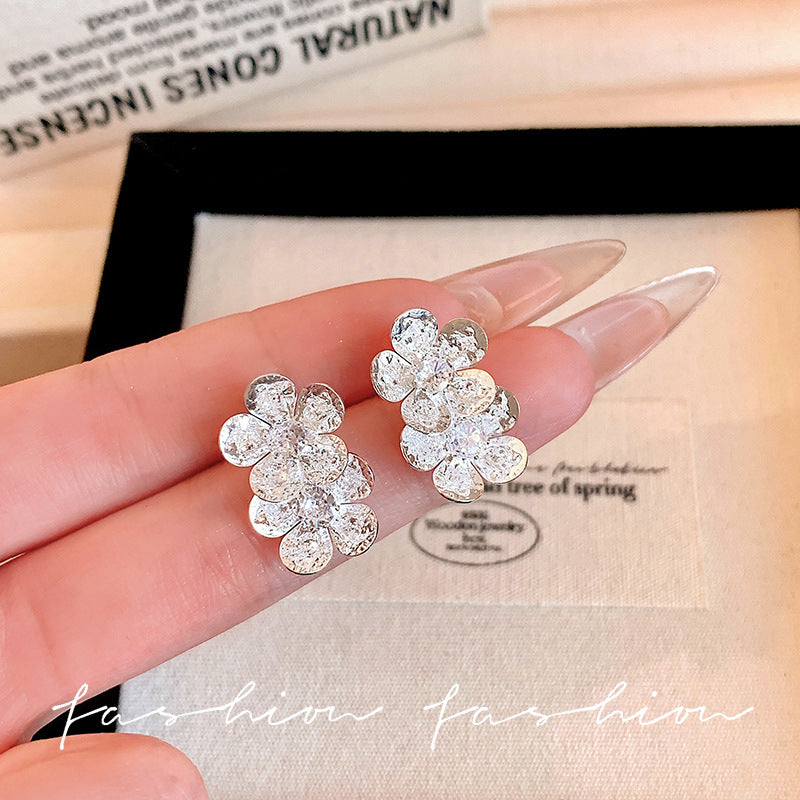 Micro-paved zirconia flower stud earrings - trendy, chic, and effortlessly elegant. a versatile and minimalist accessory for women