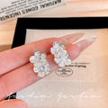 Micro-paved zirconia flower stud earrings - trendy, chic, and effortlessly elegant. a versatile and minimalist accessory for women
