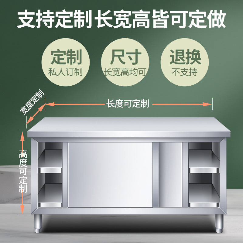 Commercial kitchen workstation: stainless steel countertop with sliding door, cutting board storage, and prep table for restaurants