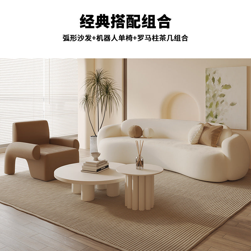 Curved, uniquely shaped, cream-toned sofa – a creative and sophisticated addition to clothing stores, beauty salons, office break rooms, and reception areas