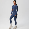 High-waisted, form-fitting yoga pants, a barely-there feel, quick-drying outer layer, and a long-sleeved tee – a women's three-piece activewear set perfect for running and workouts