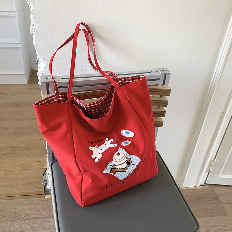 Canvas bag 2025 new women's handheld cloth bag large capacity carrying book bag junior high school students tutoring embroidered shoulder bag