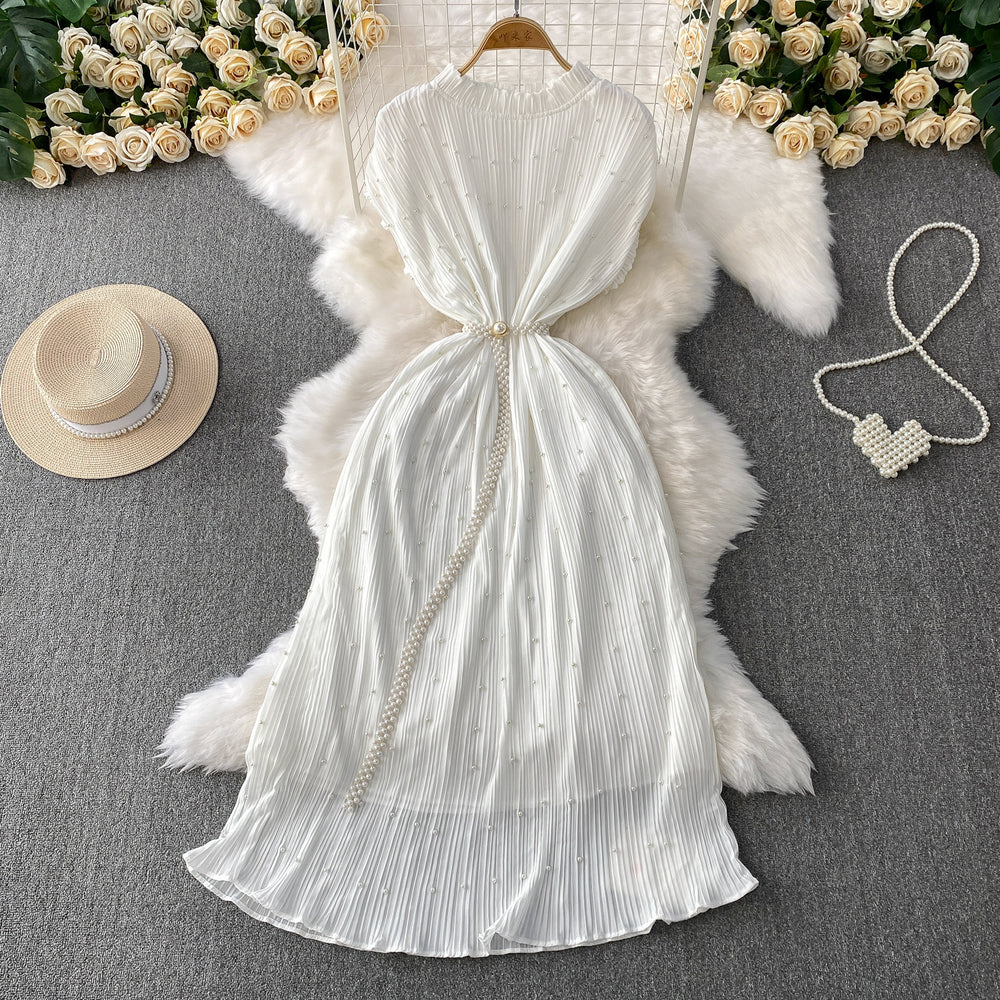 Elegant and sophisticated, this heavy-beaded, ruffled-edge, round-neck dress is a stunning new addition to your summer wardrobe. designed to flatter, it features a cinched waist and a slimming silhouette, finished with a pleated maxi skirt