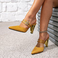 Women's gold high-heeled sandals with square buckle detail, minimalist pointed-toe design, and unique heel shape - women's sandals & mules