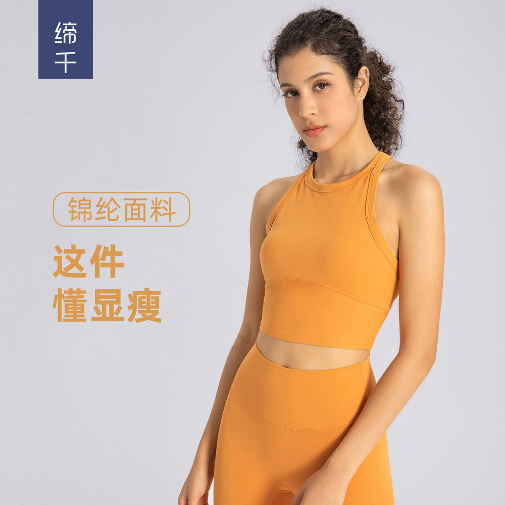 High-stretch yoga tank top for women, featuring built-in bra pads, anti-slip design, shockproof sports bra, high neckline, and side support to minimize underarm bulge. model et001