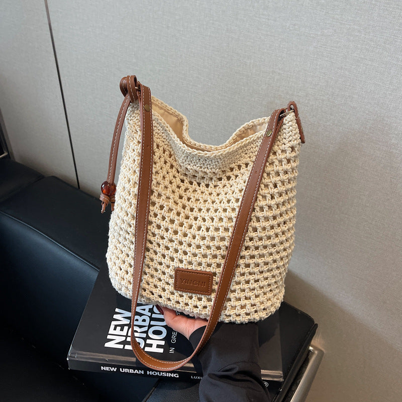 Holiday knitted bag women's 2025 summer new commuter shoulder messenger bag hollow woven bucket bag wholesale