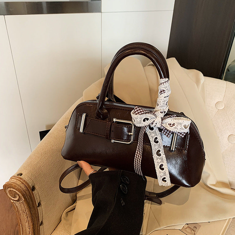 Dopamine girl hand shell bag 2025 spring and summer new Korean version shoulder bag fashion niche casual shoulder bag