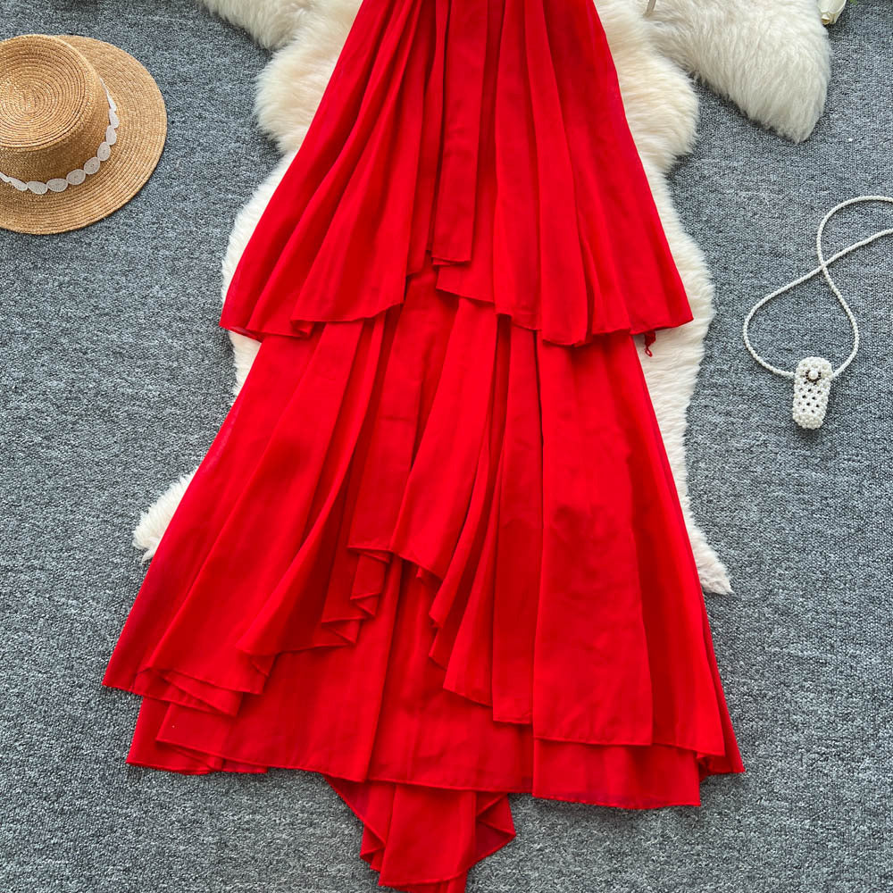 French-inspired, three-dimensional floral halter neck sleeveless dress for women. loose-fitting, slimming, casual, and featuring an asymmetrical hem in a vibrant red