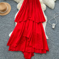 French-inspired, three-dimensional floral halter neck sleeveless dress for women. loose-fitting, slimming, casual, and featuring an asymmetrical hem in a vibrant red