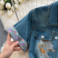 High-end women's summer dress, new arrival. features intricate embroidery, a figure-flattering cinched waist, and a sophisticated, slimming design. short-sleeved, denim, midi-length