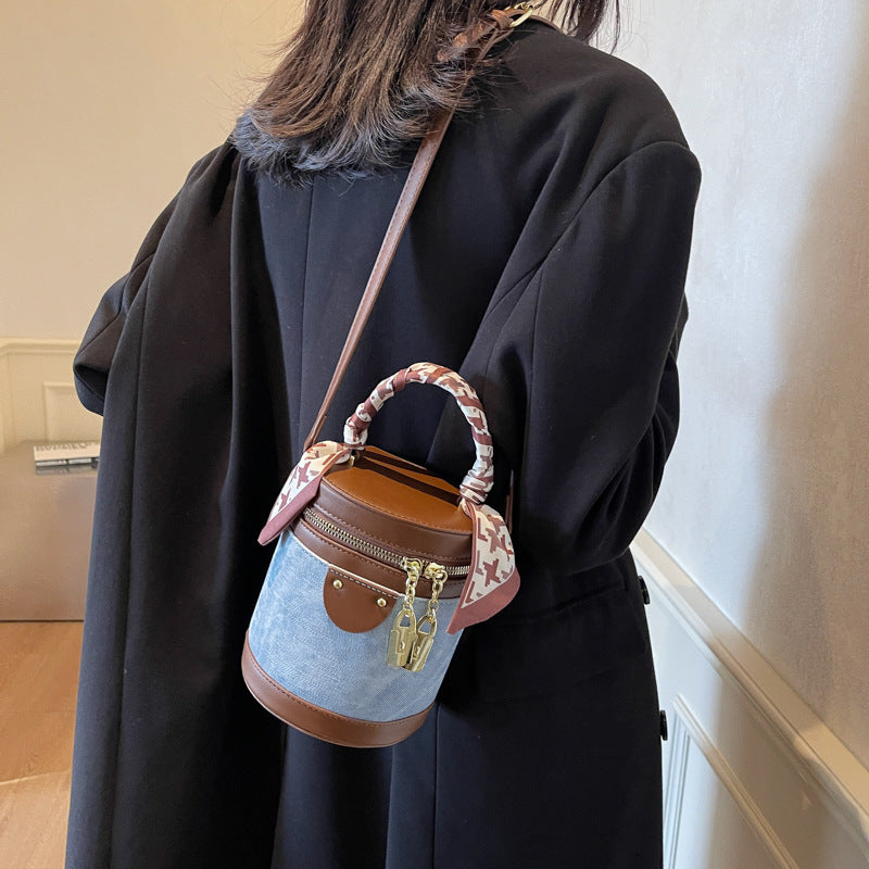 Retro contrasting color bucket bag women's 2025 new niche design portable cylinder bag versatile texture shoulder messenger bag