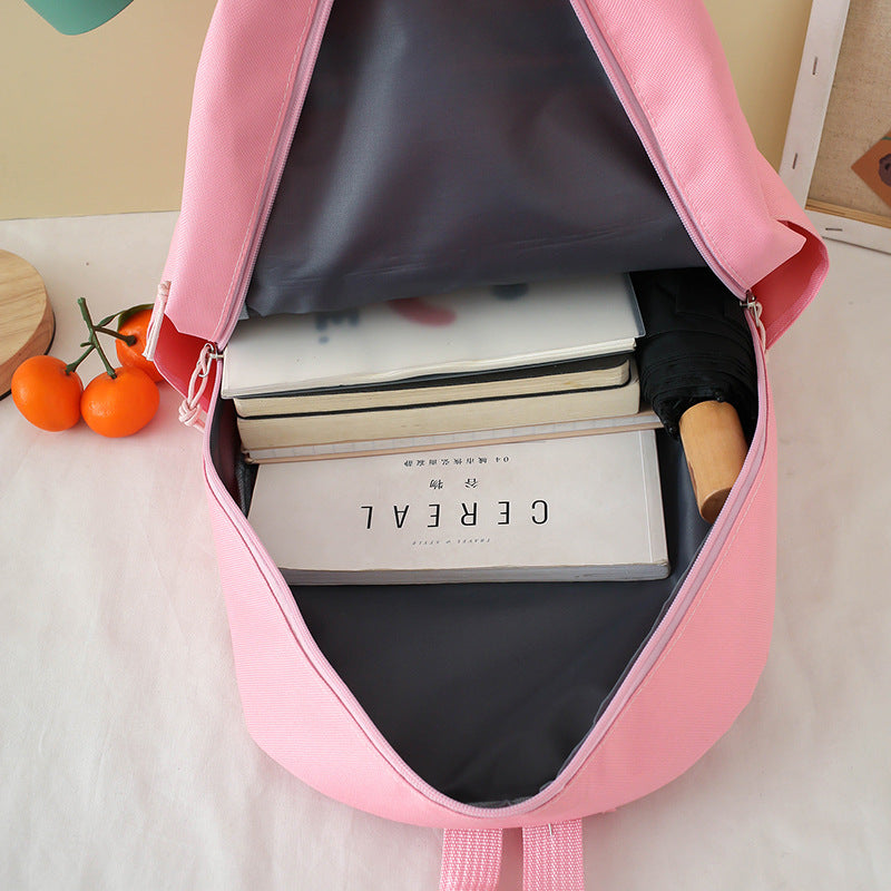 Primary school schoolbag wholesale Korean version fashion cartoon primary and secondary school backpack portable large capacity junior high school backpack