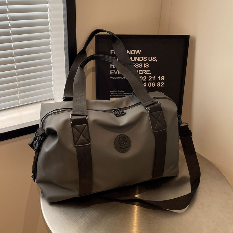 New travel bag women's travel portable hand luggage bag Korean version large-capacity messenger sports fitness bag travel bag