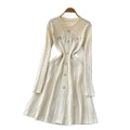 French chic, high-end, luxurious knitted dress with heavily embellished metal buckle – perfect for autumn/winter, featuring a cinched waist and ideal as a layering piece