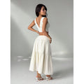 Women's embroidered v-neck sleeveless top and high-waisted a-line maxi skirt two-piece set, perfect for a stylish vacation look