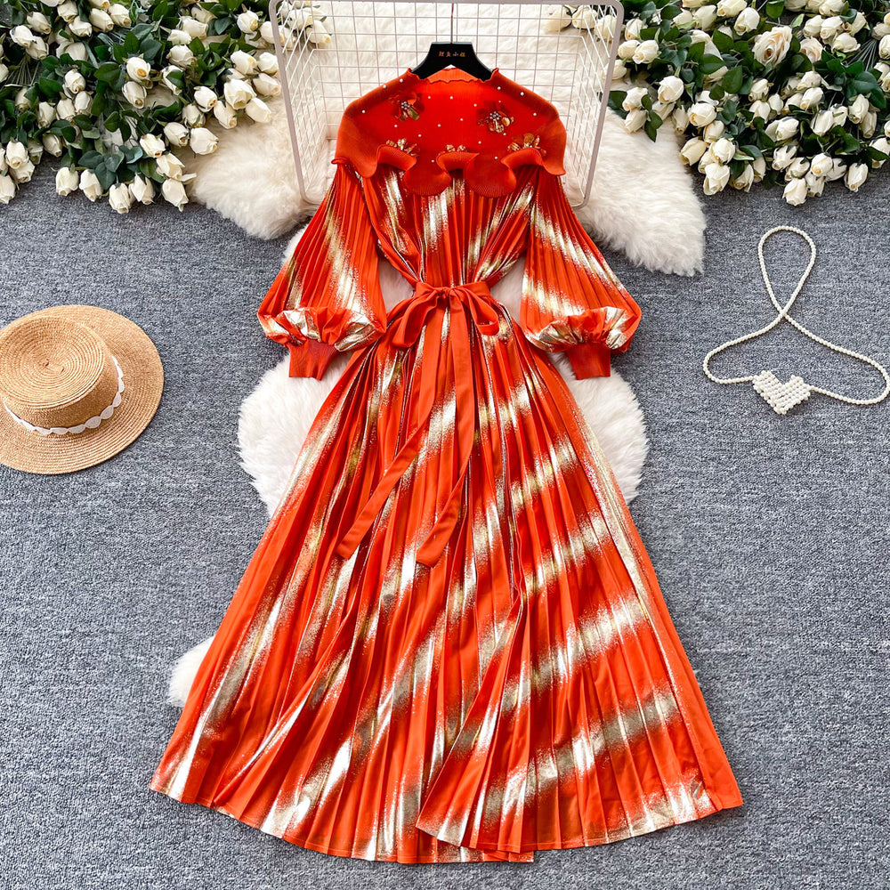 Heavy-duty beaded and gold-stamped lantern sleeve a-line dress for women, perfect for spring. features a cinched waist for a slimming effect, elegant and subtly luxurious design, and a full, flowing skirt