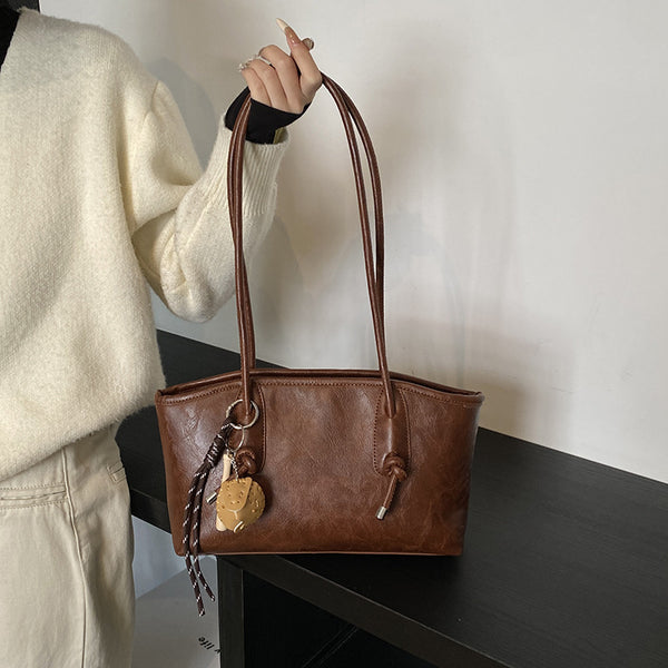 Premium sense large capacity armpit bag 2025 new simple commuter bag trend woven pendant shoulder bag bag