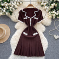 French chic chanel-inspired color block knit dress with peter pan collar, metal buckle waist, and slimming fit