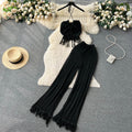 Bohemian beach vacation set for women: summer knit tassel halter top and high-waisted cutout pants two-piece outfit