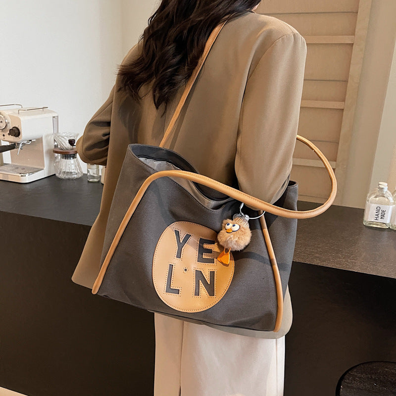 Canvas large capacity letter tote bag women's bag 2025 new casual simple handbag commuter versatile shoulder bag